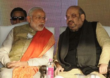 NEW DELHI, INDIA - JANUARY 31: Prime Minister Narendra Modi and BJP president Amit Shah during an election rally at Karkardooma on January 31, 2015 in New Delhi, India. Modi accused the Aam Aadmi Party of back stabbing the residents of the national capital. He said, "People can make a mistake once, but not again and again. One year back, Delhi people had voted with dreams. Last year, those whom you people voted fir, back stabbed you and shattered your dreams." (Photo by Mohd Zakir/Hindustan Times via Getty Images)