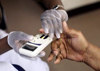 NEWARK, NJ - AUGUST 13:  A mans finger is pricked to test his cholesterol at the City of Newark's free homeless health fair at the Department of Child and Family Well-Being on August 13, 2009 in Newark, New Jersey.  The Department of Child and Family Well-Being in partnership with other health organizations gave free medical examinations to the homeless including screening for high blood pressure, cancer, and diabetes.  (Photo by Rick Gershon/Getty Images)