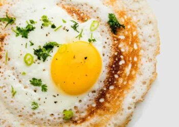 Egg Dosa is a popular south indian non-vegetarian breakfast or meal, served with sambar and chutney