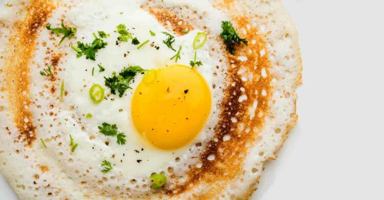 Egg Dosa is a popular south indian non-vegetarian breakfast or meal, served with sambar and chutney