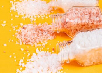 sea-salt-coming-out-salt-shakers-with-himalayan-salt_176474-1690