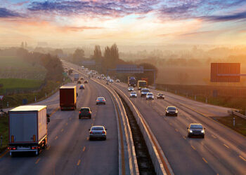 Traffic on highway with cars.