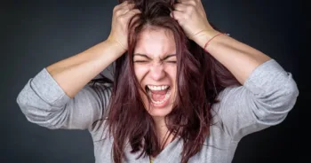 Furious angry woman screaming with frustration