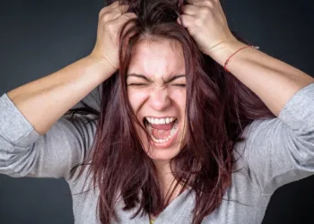 Furious angry woman screaming with frustration