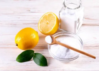 Natural products for eco friendly home cleaner, lemon, vinegar, baking soda. Homemade green cleaning.