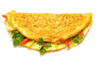 Omelet with herbs and tomatoes isolated on white