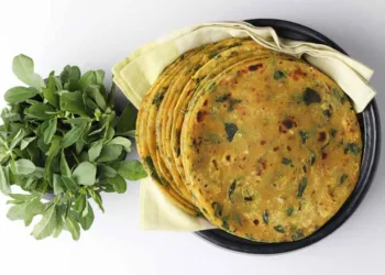 (Thepla) / Indian flat bread,Methi Paratha,an Indian flatbread stuffed with fenugreek leaves and spices served with yogurt in breakfast or brunch .