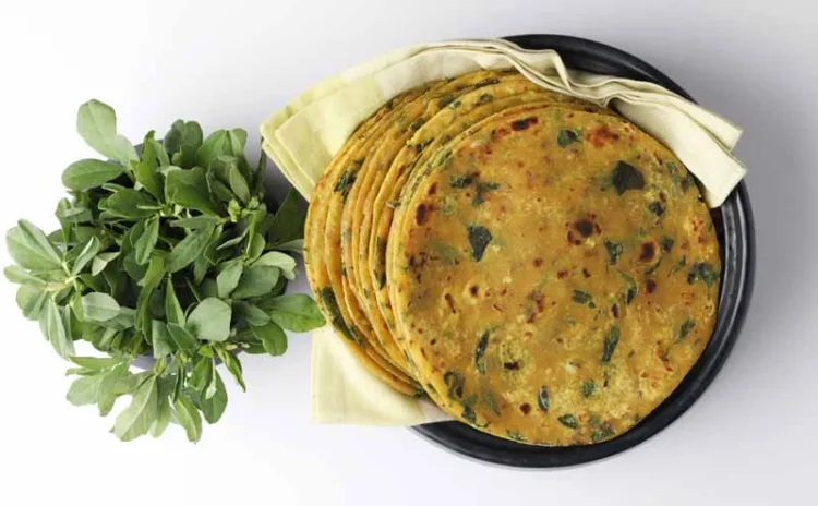 (Thepla) / Indian flat bread,Methi Paratha,an Indian flatbread stuffed with fenugreek leaves and spices served with yogurt in breakfast or brunch .