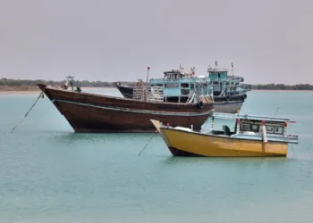 Traditional wooden ships (lenj) sail in the Gulf, off of Iran's touristic Qeshm island, on April 29, 2023. From Muscat to Bandar Abbas via Dubai, the potbellied silhouette of the lenjs is part of the maritime landscape of the Middle East, just like that of the sailing dhows of the Arabian Peninsula. (Photo by ATTA KENARE / AFP)