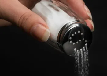 hand-pouring-salt-from-a-shaker