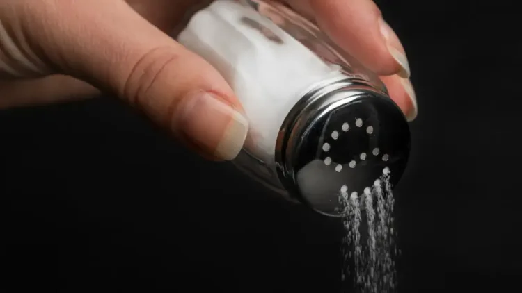 hand-pouring-salt-from-a-shaker