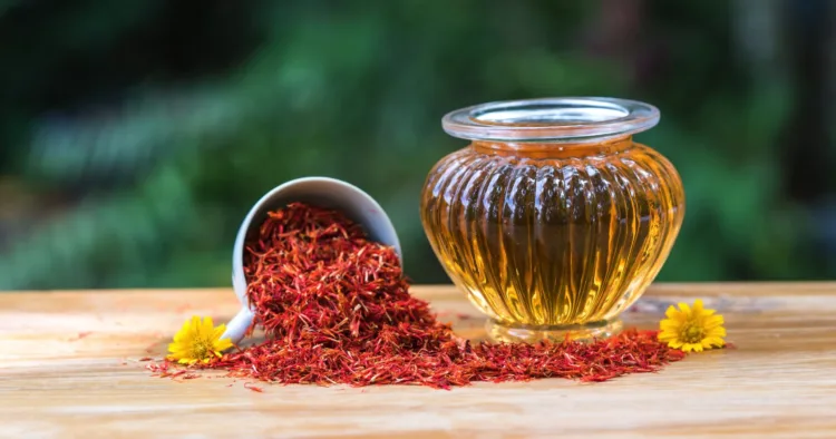 Safflower  oil  in  glass  bottle  on  wooden