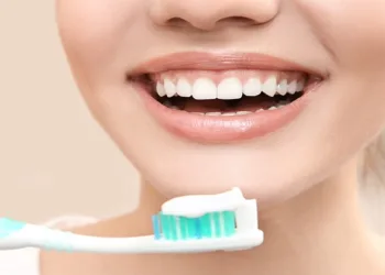 Beautiful woman brushing teeth, closeup