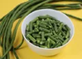 Long bean or sting bean pieces in white bowl, cooking ingredient