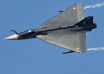This photograph taken on November 20, 2025 shows the Indian Air Force's HAL Tejas fighter jet which crashed the following day performing a flying display at Al-Maktoum International Airport during the Dubai Airshow 2025 in Dubai. The Indian fighter jet crashed during a flying display at the Dubai Airshow on November 21, killing the pilot in front of hundreds of shocked onlookers. The Indian-made Tejas warplane was executing a manoeuvre when it plunged to the ground and erupted in a fireball. The pilot was unable to eject. (Photo by Giuseppe CACACE / AFP)